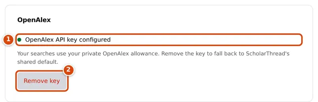 The OpenAlex card after a key is saved, reading OpenAlex API key configured, with a Remove key button